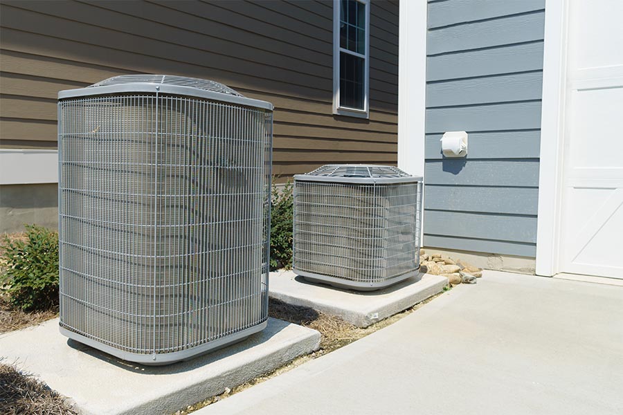 Residential air conditioning units outside. Ask ChatGPT